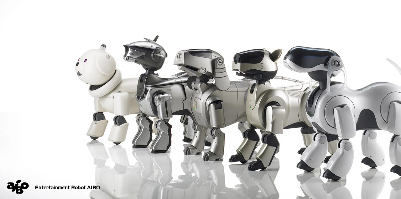 5 generations of Aibo robot dogs.