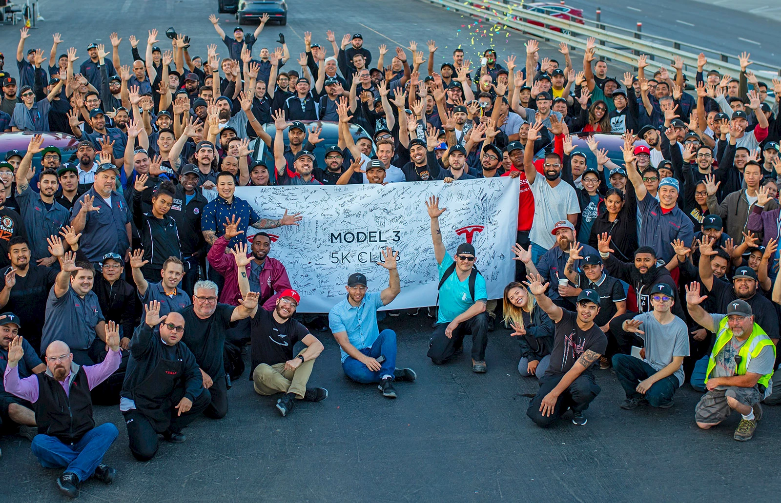 Tesla team celebrates production milestone.