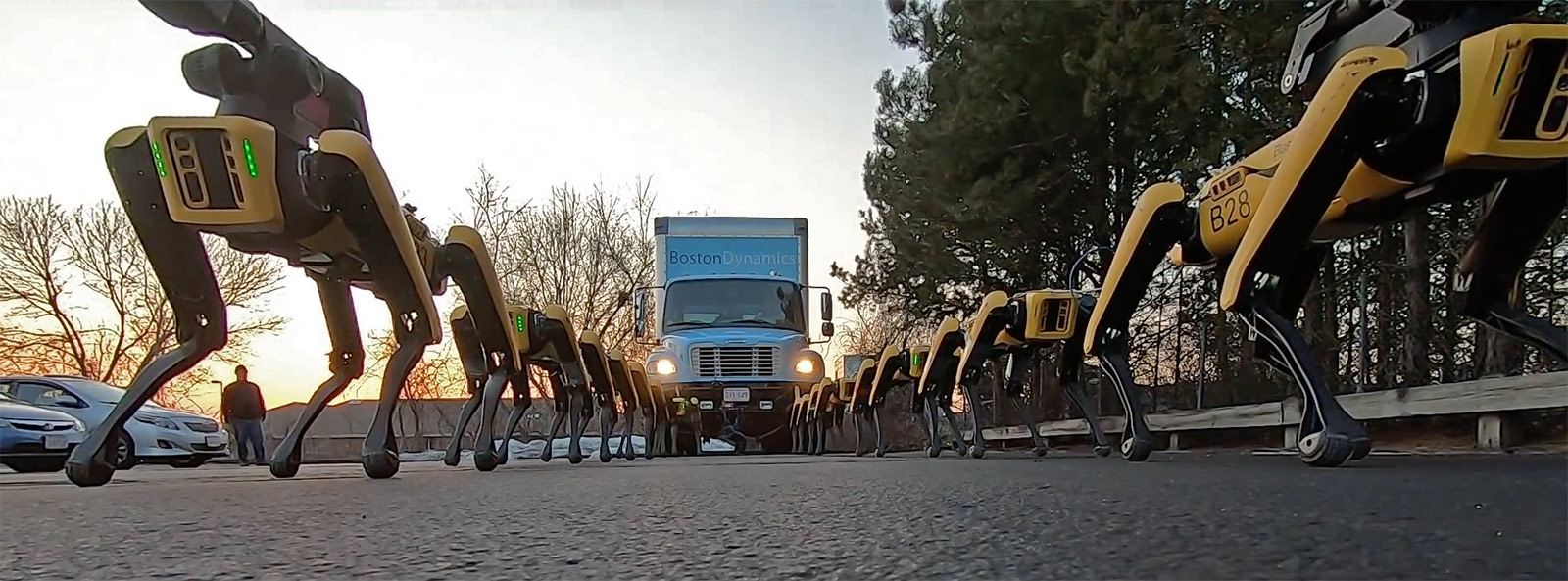 SpotMini robots pull a box truck.